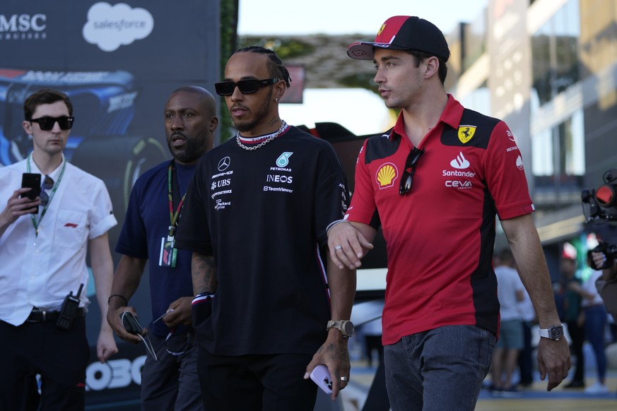 Mercedes driver Lewis Hamilton of Britain, left, and Ferrari driver Charles Leclerc of Monaco arrive to speak to media ahead of the Formula On Saudi Arabian Grand Prix in Jeddah, Saudi Arabia, Thursda ...