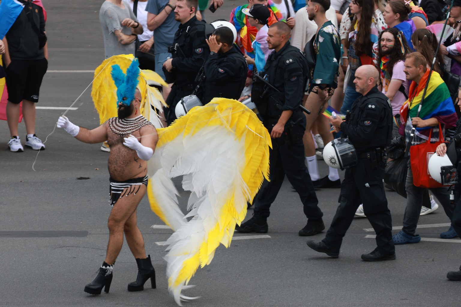 epa11499856 A participant wears wings during the &#039;CSD Berlin 2024&#039; the 46th Christopher Street Day parade in Berlin, Germany, 27 July 2024. CSD is an annual European LGBTIQA* (lesbian, gay,  ...