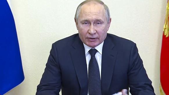 In this photo taken from video released by the Russian Presidential Press Service, Russian President Vladimir Putin speaks during a meeting on measures of socio-economic support of the regions via vid ...