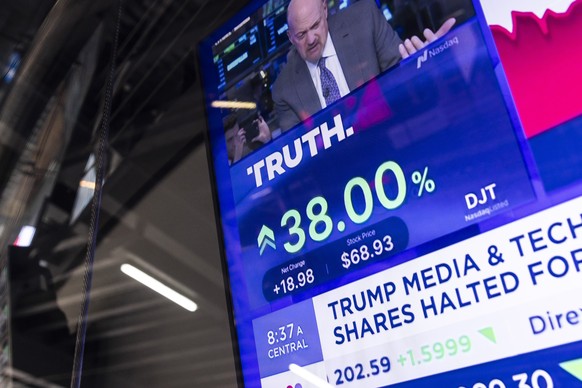epa11244614 A television screen shows the share price for the Trump Media and Technology Group, the parent company of former US President Donald Trump&#039;s social media platform Truth Social, as the ...
