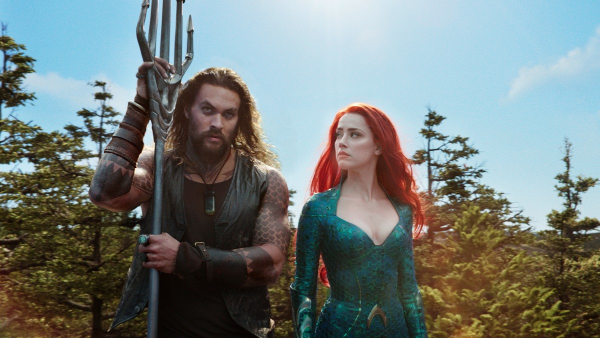 This image released by Warner Bros. Pictures shows Jason Momoa, left, and Amber Heard in a scene from the film, "Aquaman." (Warner Bros. Pictures via AP)
