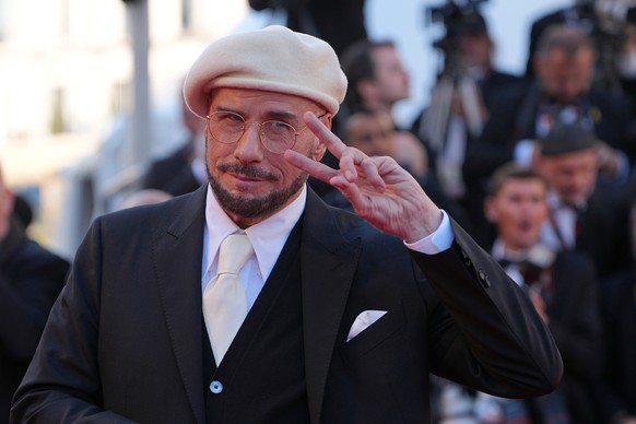 KEYPIX - John Travolta poses for photographers upon arrival at the premiere of the film 'Karma' at the 79th international film festival, Cannes, southern France, Friday, May 15, 2026. (AP Ph ...