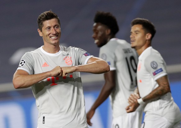 epa08604401 Robert Lewandowski (L) of Bayern Munich celebrates scoring the 6-2 lead during the UEFA Champions League quarter final match between Barcelona and Bayern Munich in Lisbon, Portugal, 14 Aug ...