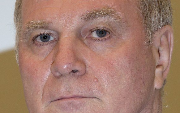 Bayern Munich President Uli Hoeness arrives  for the second day of his trial for tax evasion at the regional court in Munich March 11, 2014. Hoeness stunned a German court on Monday by admitting he had evaded taxes of 18.5 million euros ($26 million) using a secret Swiss bank account - more than five times the amount on a prosecutors' charge sheet.  Once one of Germany's most admired managers, Hoeness apologised and appealed for leniency at the start of a trial in a case that shocked Germany and prompted other tax dodgers to turn themselves in. Hoeness could be sentenced to between five and 10 years in jail if convicted of evading more than 1 million euros in taxes.                             REUTERS/Sven Hoppe/Pool  (GERMANY  - Tags: SPORT SOCCER CRIME LAW BUSINESS)  