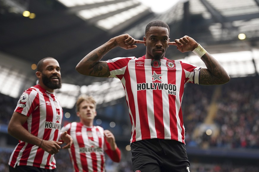 Brentford&#039;s Ivan Toney celebrates after scoring his side&#039;s first goal during the English Premier League soccer match between Manchester City and Brentford, at the Etihad stadium in Mancheste ...