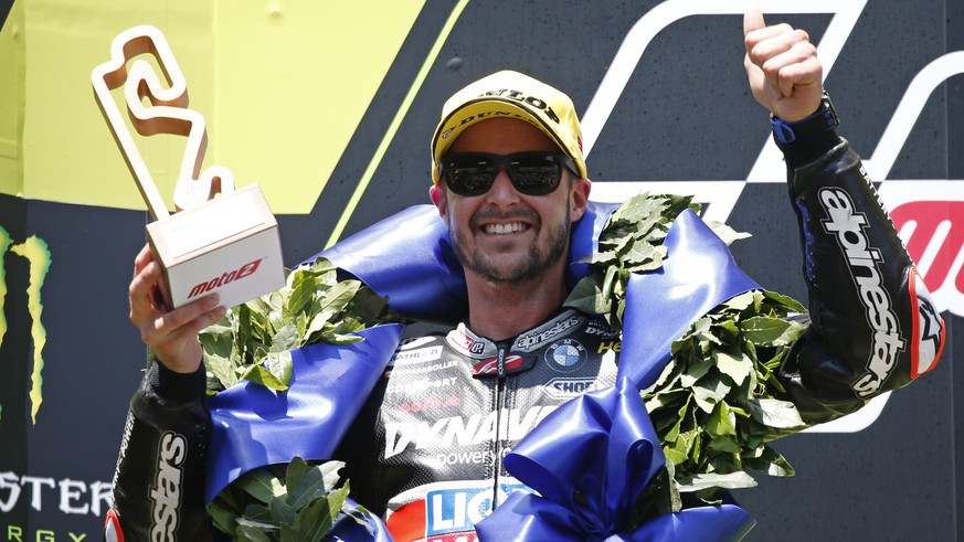 Swiss Tom Luethi celebrates after his second place at the Moto2 Catalunya Motorcycle Grand Prix at the Barcelona Catalunya racetrack in Montmelo, near Barcelona, Spain, on Sunday June 16, 2019. (AP Ph ...