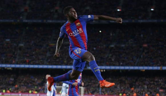 FC Barcelona&#039;s Samuel Umtiti celebrates after scoring during the Spanish La Liga soccer match between FC Barcelona and Celta Vigo at the Camp Nou in Barcelona, Spain, Saturday, March 4, 2017. (AP ...