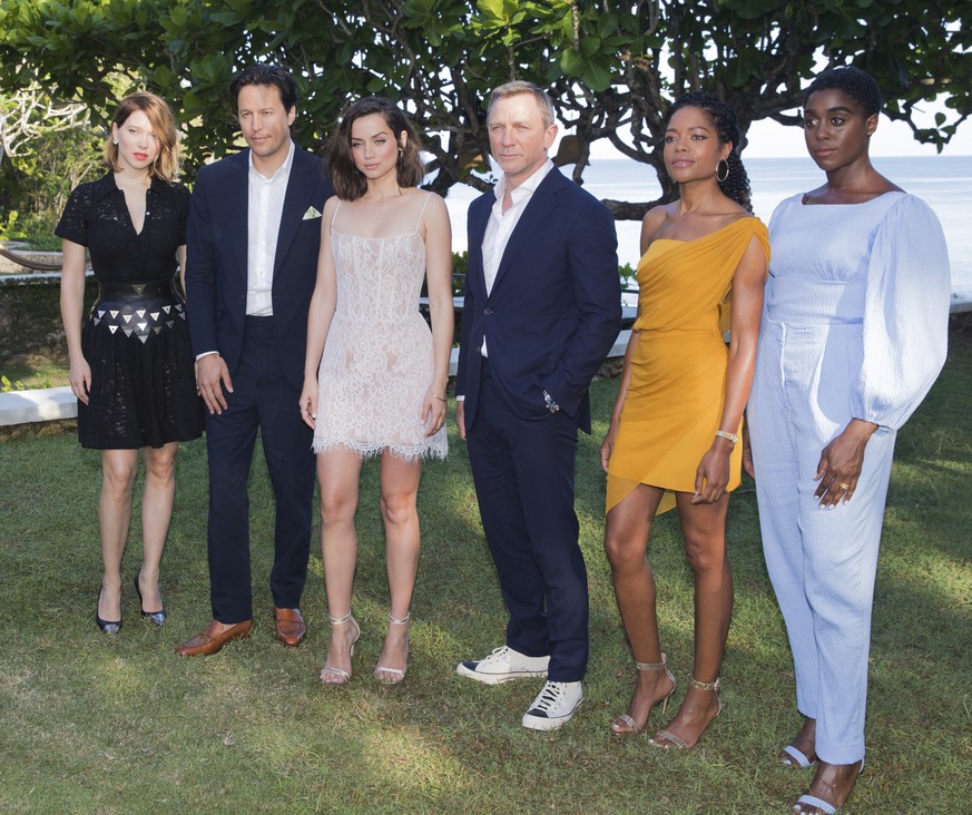 Actress Lea Seydoux, from left, director Cary Joji Fukunaga, actors Ana de Armas, Daniel Craig, Naomie Harris and Lashana Lynch pose for photographers during the photo call of the latest installment o ...