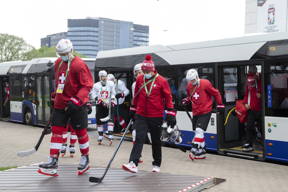 Switzerland's players arrive at the Olympic Sport Center after a training session, one day before starting the IIHF 2021 World Championship, at the Olympic Sports Center, in Riga, Latvia, Thursda ...