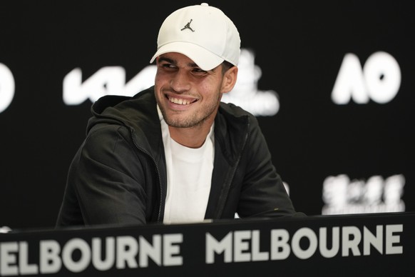 Spain&#039;s Carlos Alcaraz reacts during a press conference ahead of the Australian Open tennis championships at Melbourne Park, Melbourne, Australia, Saturday, Jan. 13, 2024. (AP Photo/Alessandra Ta ...