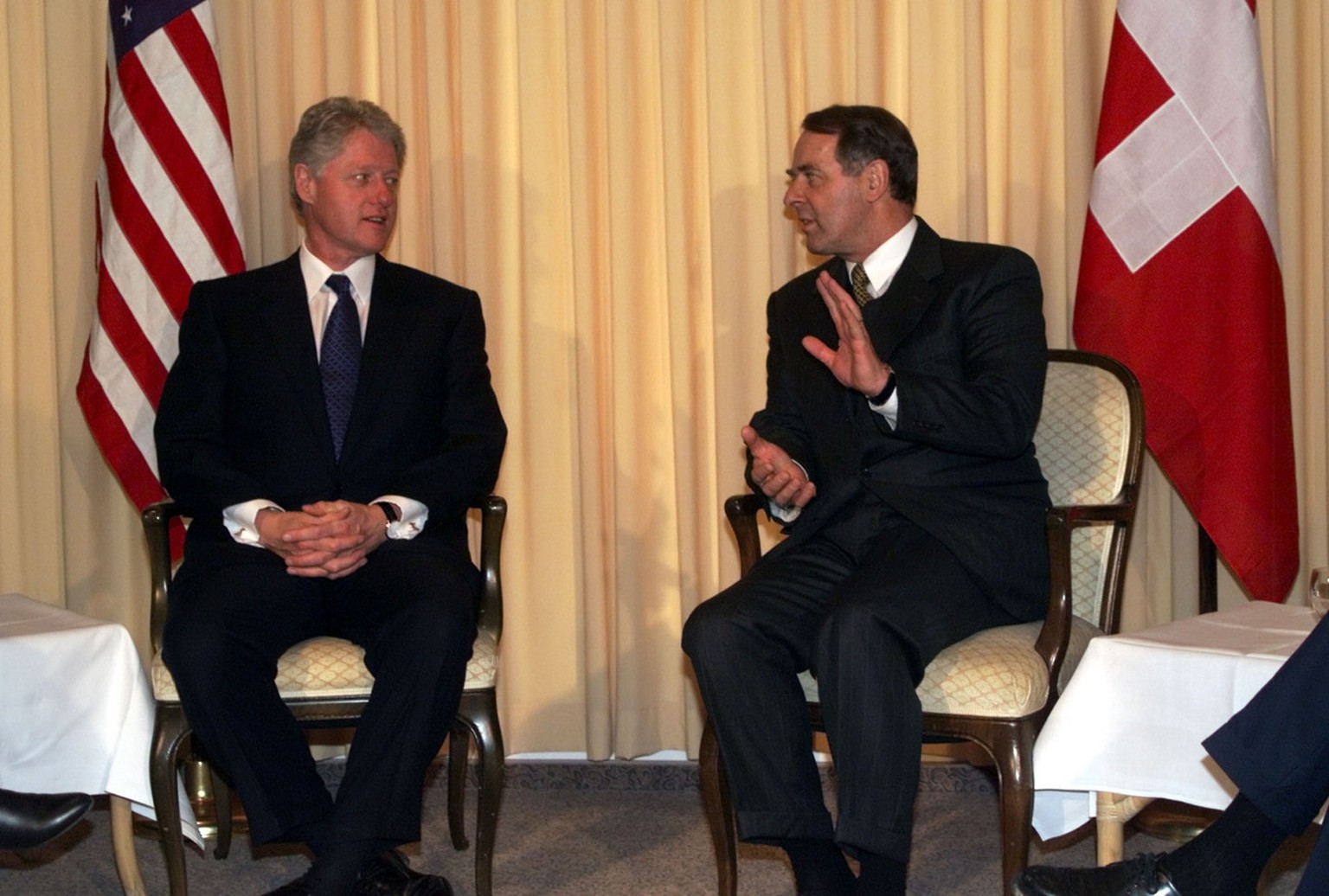 U.S. President Bill Clinton meets with Swiss President Adolf Ogi at the Belvedere Hotel in Davos, Saturday, January 29, 2000. Businessmen, scholars and world leaders are gathering in this exclusive Sw ...