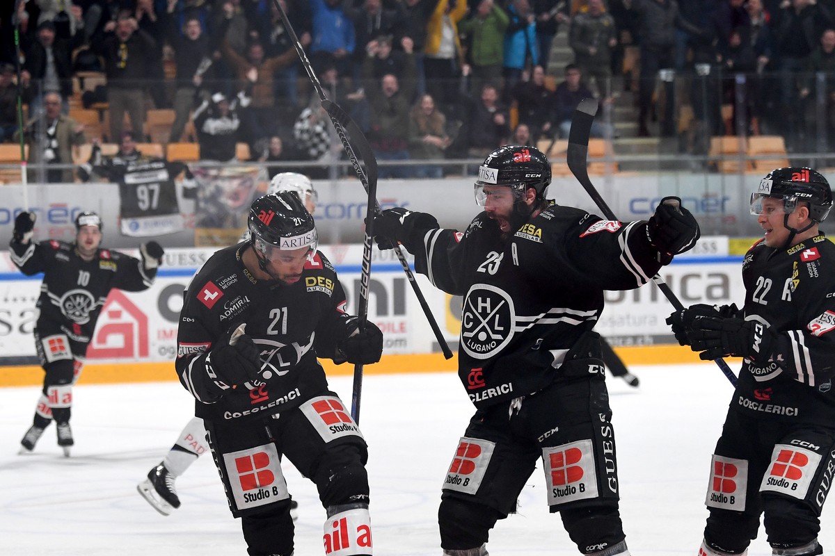 Lugano's player Troy Josephs left, celebrate the 1 - 0 goal with Lugano's player Giovanni Morini center and Lugano's player Santeri Alatalo right, during the second game of the pre play ...
