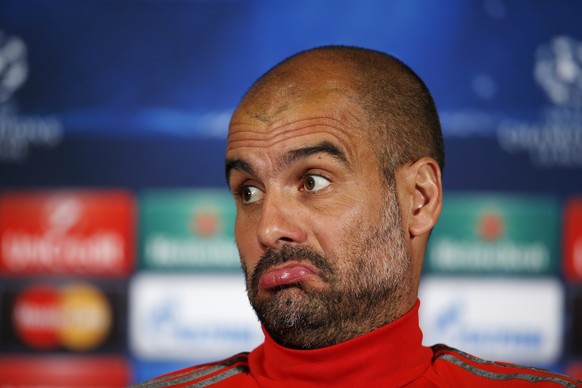 Bayern Munich manager Pep Guardiola reacts during a news conference in Porto April 14, 2015. Bayern Munich will play their Champions League quarter-final first leg soccer match against Porto on Wednes ...