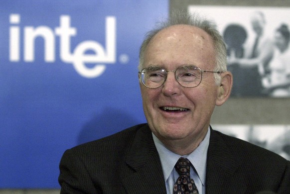 FILE - Gordon Moore, the legendary Intel Corp. co-founder who predicted the growth of the semiconductor industry, smiles during a news conference, Thursday, May 24, 2001, in Santa Clara, Calif. Moore, ...