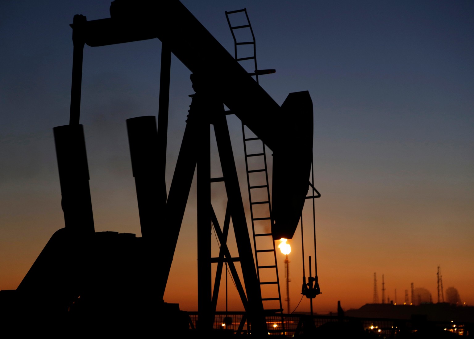 FILE - In this Jan. 18, 2016 file photo, an oil pump works at sunset, in the desert oil fields of Sakhir, Bahrain. (AP Photo/Hasan Jamali, File)
Iran US Key Oil Facilities