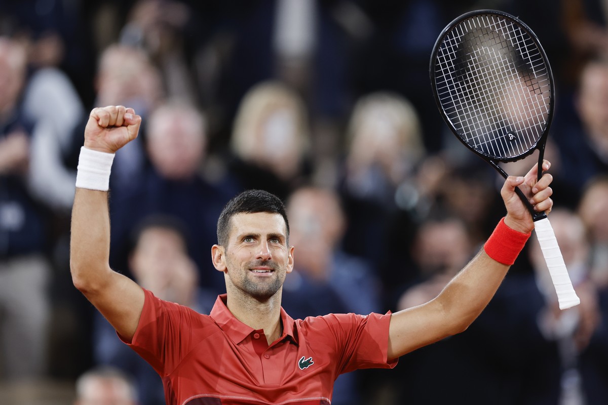 Serbia's Novak Djokovic celebrates winning his second round match of the French Open tennis tournament against Spain's Roberto Carballes Baena at the Roland Garros stadium in Paris, Thursday ...