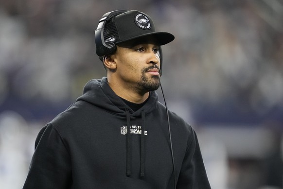 Philadelphia Eagles&#039; Jalen Hurts is seen on the sideline during the second half of an NFL football game against the Dallas Cowboys Saturday, Dec. 24, 2022, in Arlington, Texas. (AP Photo/Tony Gut ...
