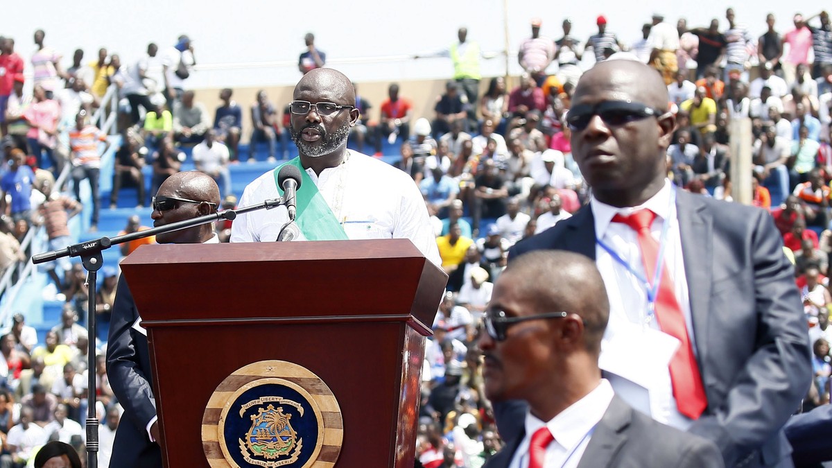 epa06465361 Liberia's President George Weah (C) speaks during his inauguration ceremony at the Samuel Kanyon Doe stadium in Monrovia, Liberia, 22 January 2018. The inauguration of President-elect ...