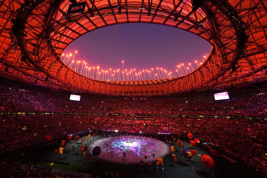 Fireworks explode as artists perform during the World Cup closing ceremony before the final soccer match between Argentina and France at the Lusail Stadium in Lusail, Qatar, Sunday, Dec. 18, 2022. (AP ...