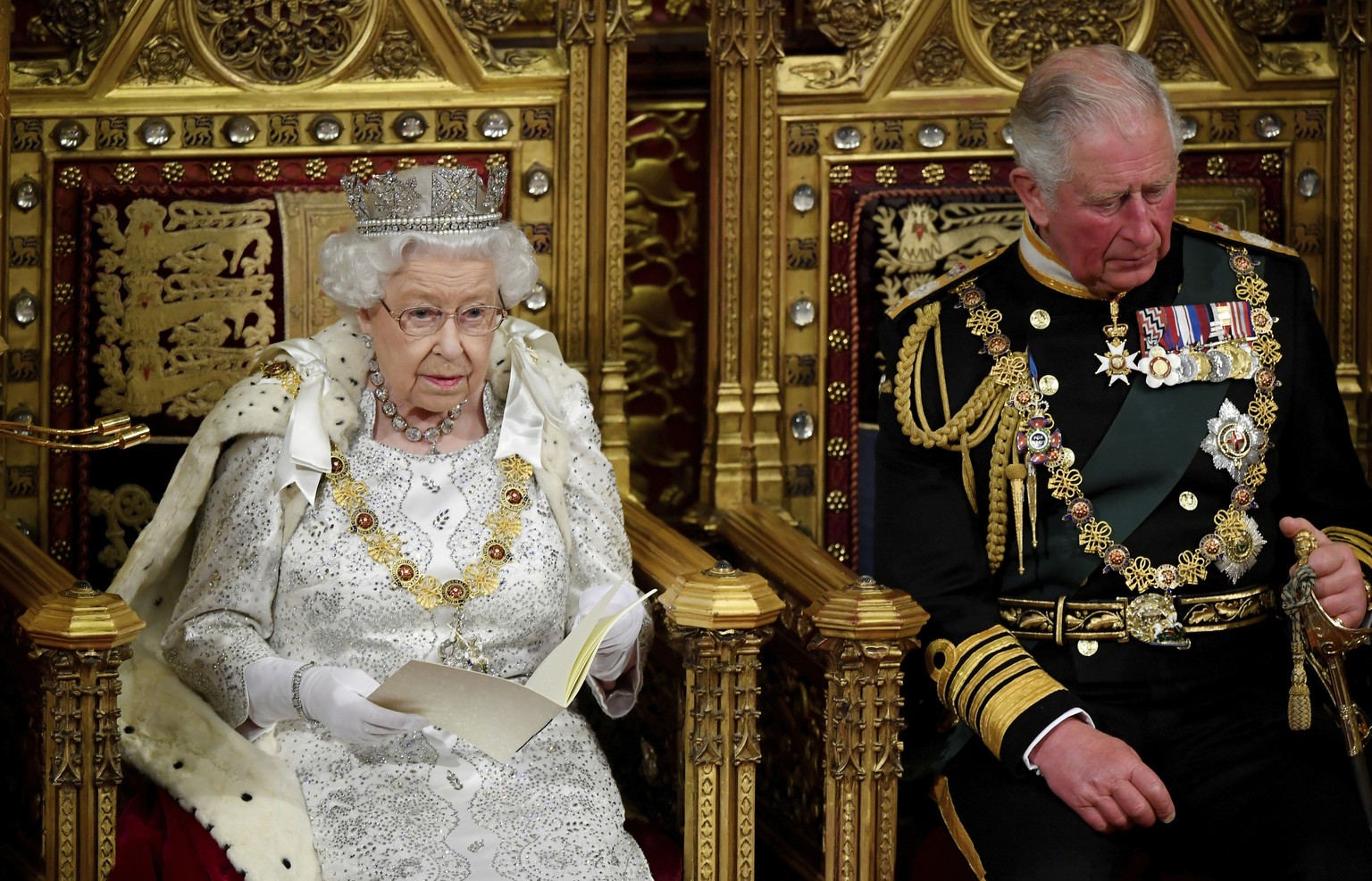 Britain&#039;s Queen Elizabeth II delivers the Queen&#039;s Speech during the official State Opening of Parliament in London, Monday Oct. 14, 2019. (Toby Melville/Pool via AP)