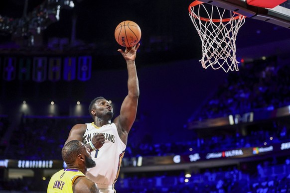 New Orleans Pelicans forward Zion Williamson (1) shoots over Los Angeles Lakers forward LeBron James during the first half of a semifinal in the NBA basketball In-Season Tournament, Thursday, Dec. 7,  ...