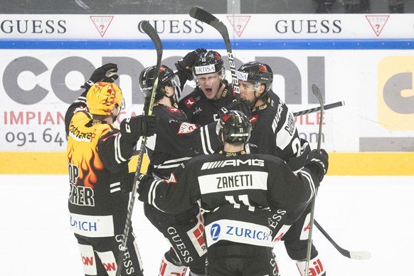 Lugano&#039;s players celebrate the 1-0 goal during the second leg of the National League Swiss Championship quarter final playoff game between HC Lugano against Geneve Servette HC at the ice stadium  ...