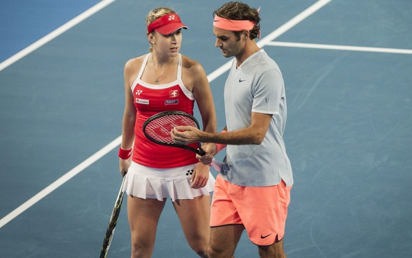 epa05695458 Belinda Bencic and Roger Federer of Switzerland during the mixed doubles match between Great Britain and Switzerland in session 4 of the Hopman Cup at the Arena in Perth, Australia, 02 Jan ...