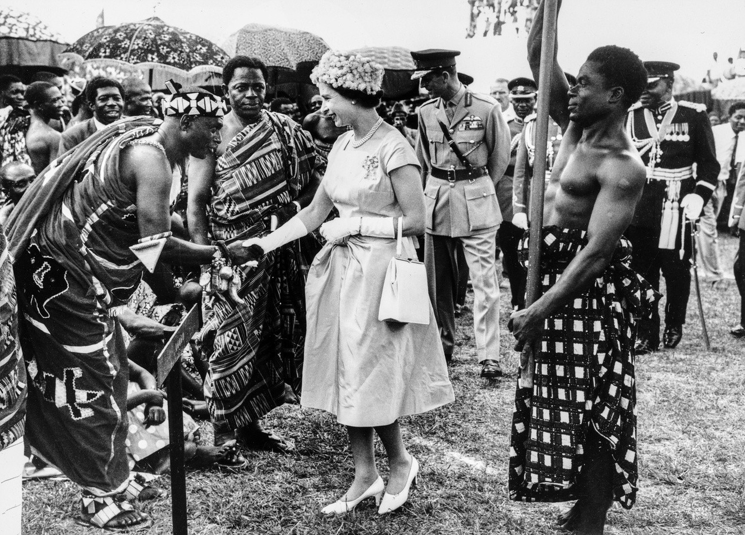 FILE - Britain&#039;s Queen Elizabeth II and her husband Prince Philip, Duke of Edinburgh, meet leaders of the Ashanti ethnic group at the packed Kumasi Stadium during their visit to Ghana, pictured N ...