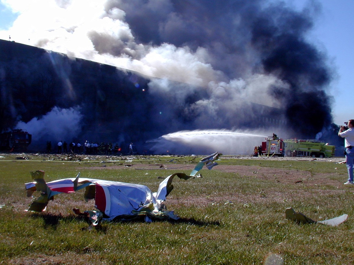Wreckage from the hijacked American Airlines FLT 77 sits on the lawn of the Pentagon minutes after the aircraft slammed into the southwest corner of the building in this U.S. Navy handout photo dated  ...