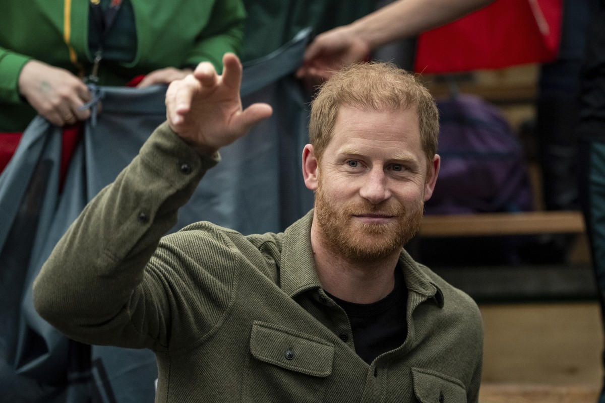 FILE - Prince Harry, the Duke of Sussex, cheers with Team Lithuania during Sitting Volleyball at the 2025 Invictus Games, in Vancouver, on Saturday, Feb. 15, 2025. (Ethan Cairns/The Canadian Press via ...
