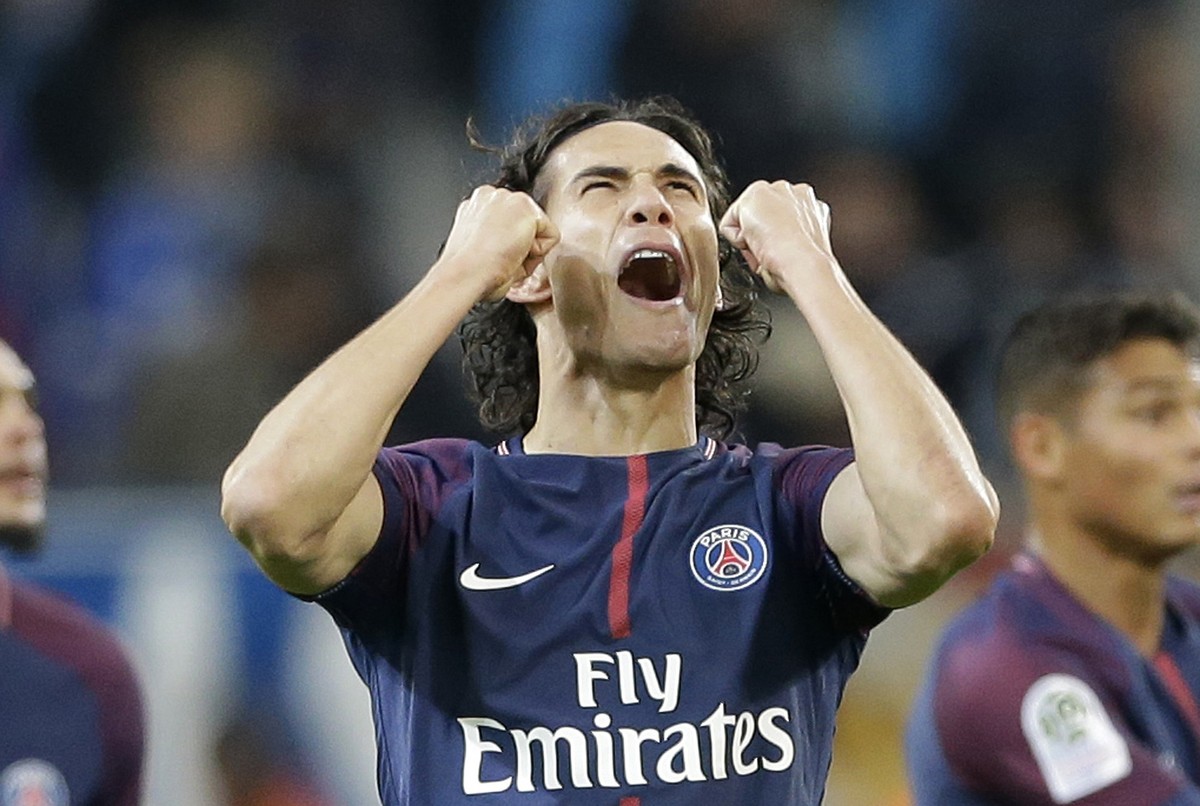 PSG's Edinson Cavani, celebrates after scoring during the League One soccer match between Marseille and Paris Saint-Germain, at the Velodrome stadium, in Marseille, southern France, Sunday, Oct.  ...