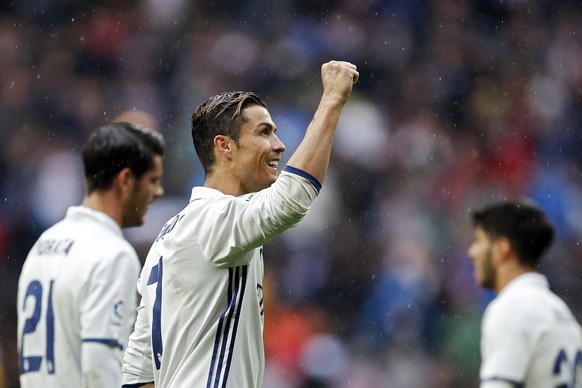 Real Madrid&#039;s Cristiano Ronaldo celebrates at the end of the Spanish La Liga soccer match between Real Madrid and Valencia at the Santiago Bernabeu stadium in Madrid, Saturday, April 29, 2017. Ro ...