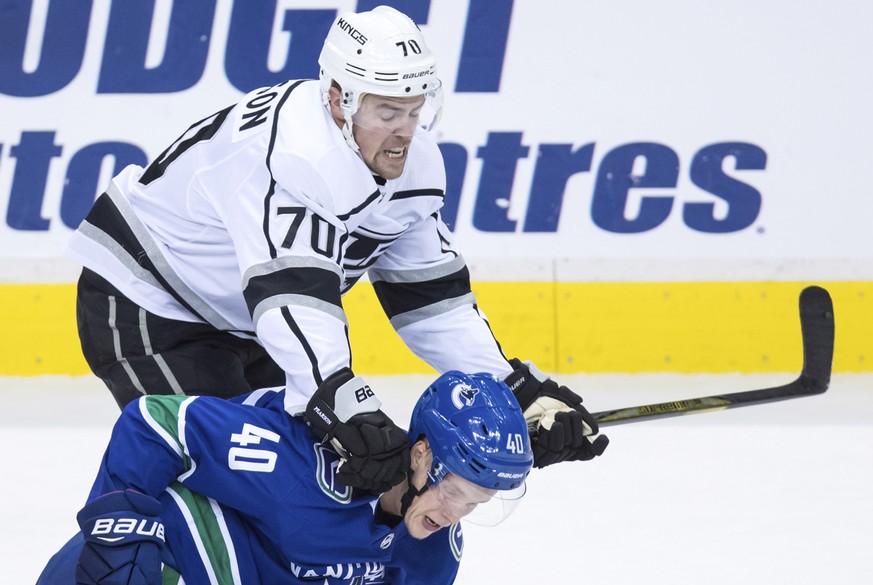 Los Angeles Kings&#039; Tanner Pearson (70) checks Vancouver Canucks&#039; Elias Pettersson (40), of Sweden, during the first period of an NHL hockey preseason game Thursday, Sept. 20, 2018, in Vancou ...