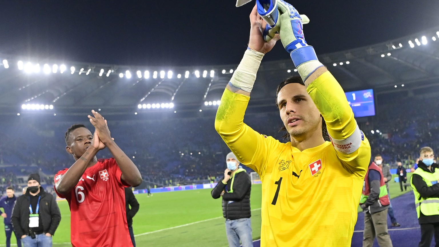 Switzerland&#039;s goalkeeper Yann Sommer, cnter, and Switzerland&#039;s defender Denis Zakaria, left, cheer after the 2022 FIFA World Cup European Qualifying Group C match between Italy and Switzerla ...
