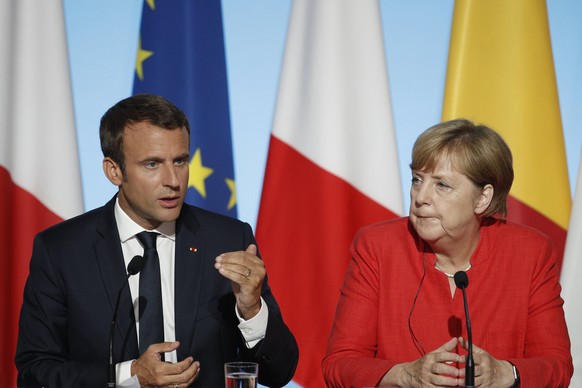 epa06168946 French President Emmanuel Macron and German Chancellor Angela Merkel attend a press conference at the Elysee Palace in Paris, France, 28 August 2017. Leaders from Germany, Spain, Italy and ...