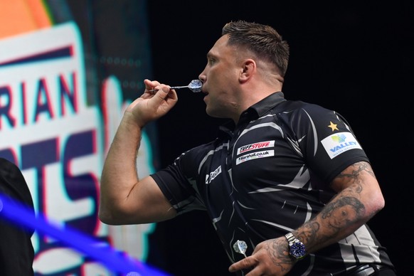 epa09954416 Gerwyn Price of Wales in action against Fallon Sherrock of England during the Hungarian Darts Show at the MVM Dome in Budapest, Hungary, 17 May 2022 (issued 18 May 2022). EPA/Tibor Illyes ...