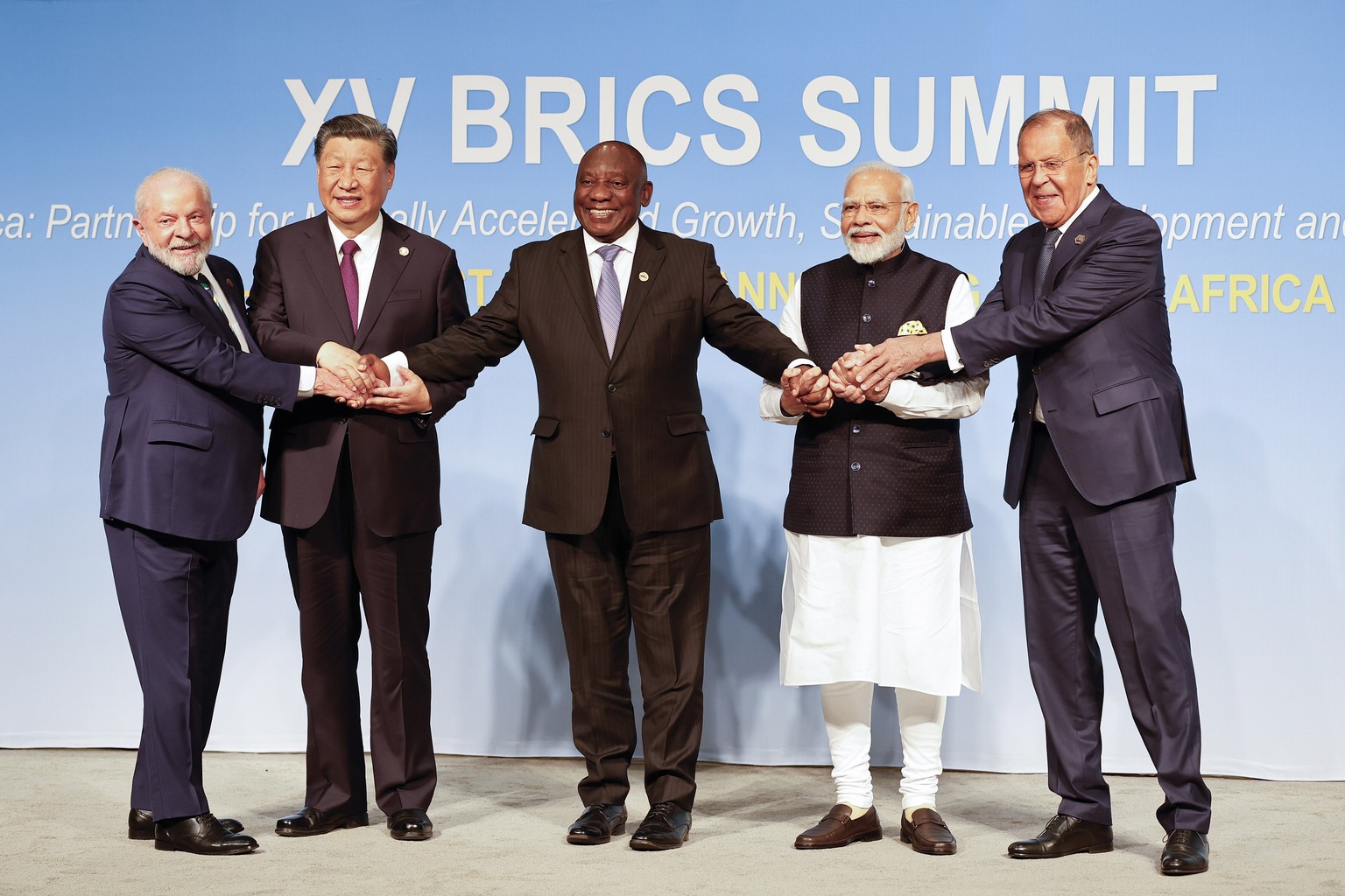 From left, Brazil President Luiz Inacio Lula da Silva, China President Xi Jinping, South African President Cyril Ramaphosa, Prime Minister of India Narendra Modi and Russia&#039;s Foreign Minister Ser ...