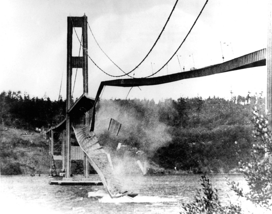 FILE - In this Nov. 7, 1940 file photo, a large section of the concrete roadway in the centre span of the new Tacoma Narrows Bridge collapses into Puget Sound between Tacoma and the Kitsap Peninsula,  ...