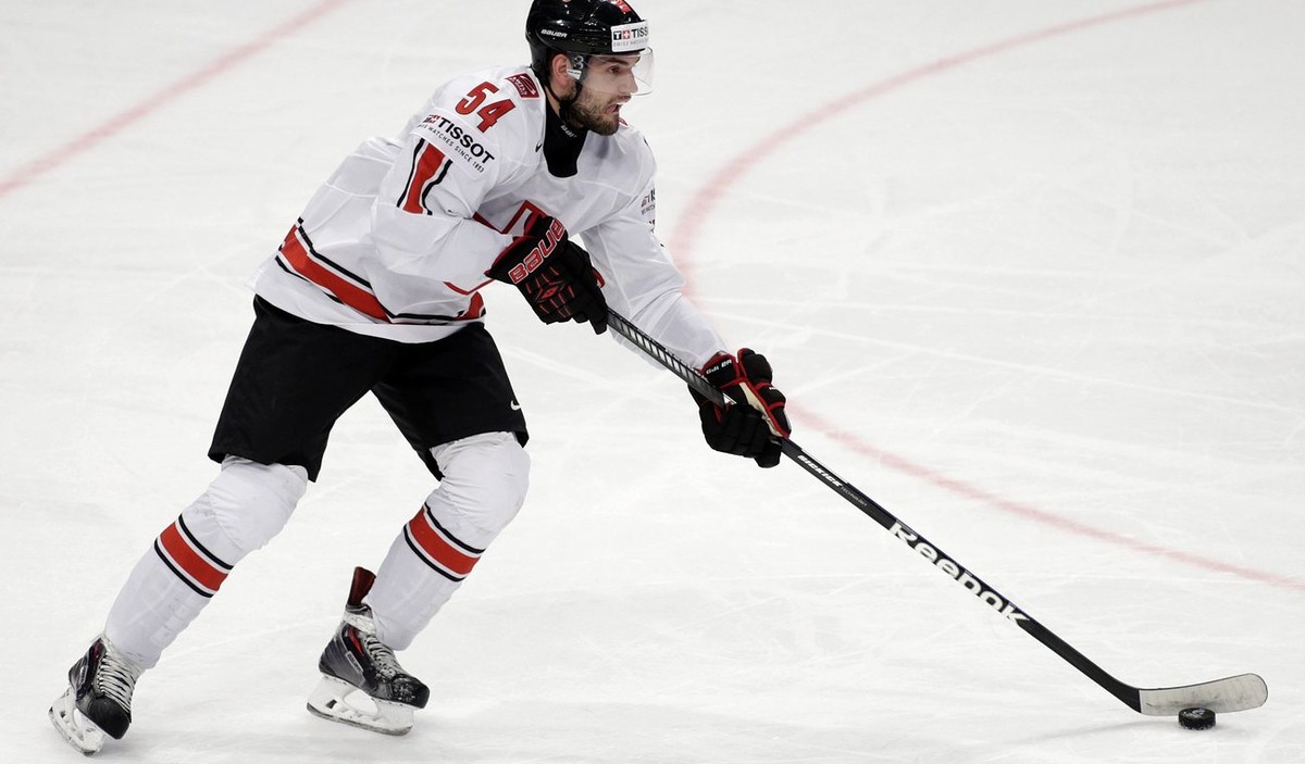 Switzerland's Philippe Furrer controls the puck, during the IIHF Ice Hockey World Championships preliminary round game Norway vs Switzerland at the Globe Arena in Stockholm, Sweden, on Sunday, 12 ...