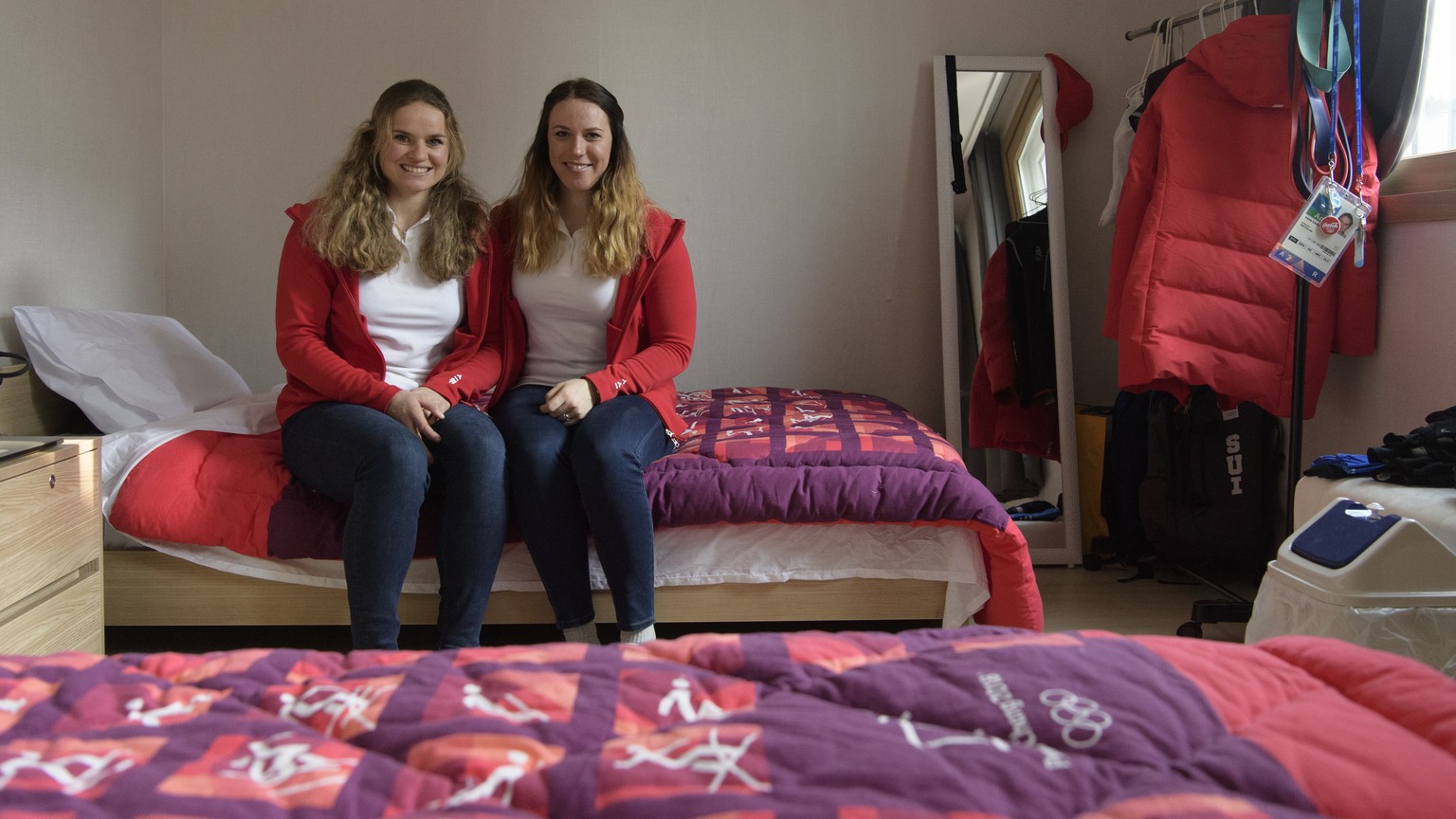 Swiss biathlon athletes Lena Haecki, right, and Irene Cadurisch, pose during a media tour through the Pyeongchang Olympic Village one day prior to the opening of the XXIII Winter Olympics 2018 in Pyeo ...