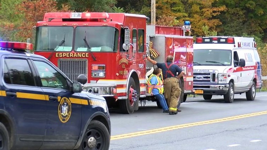 In this Saturday, Oct. 6, 2018 photo, emergency personnel respond to the scene of a deadly crash involving a limousine in Schoharie, N.Y. (WTEN via AP)