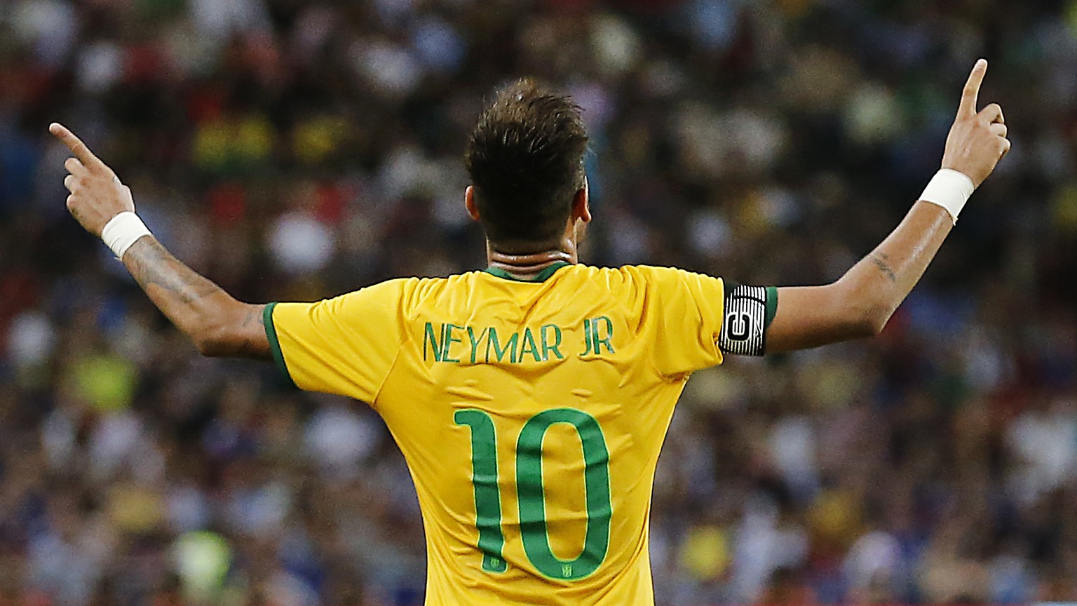 FILE - In this Oct. 14, 2014, file photo, Brazil&#039;s Neymar celebrates after scoring the forth goal during an international friendly soccer match in Singapore. (AP Photo/Wong Maye-E,File)