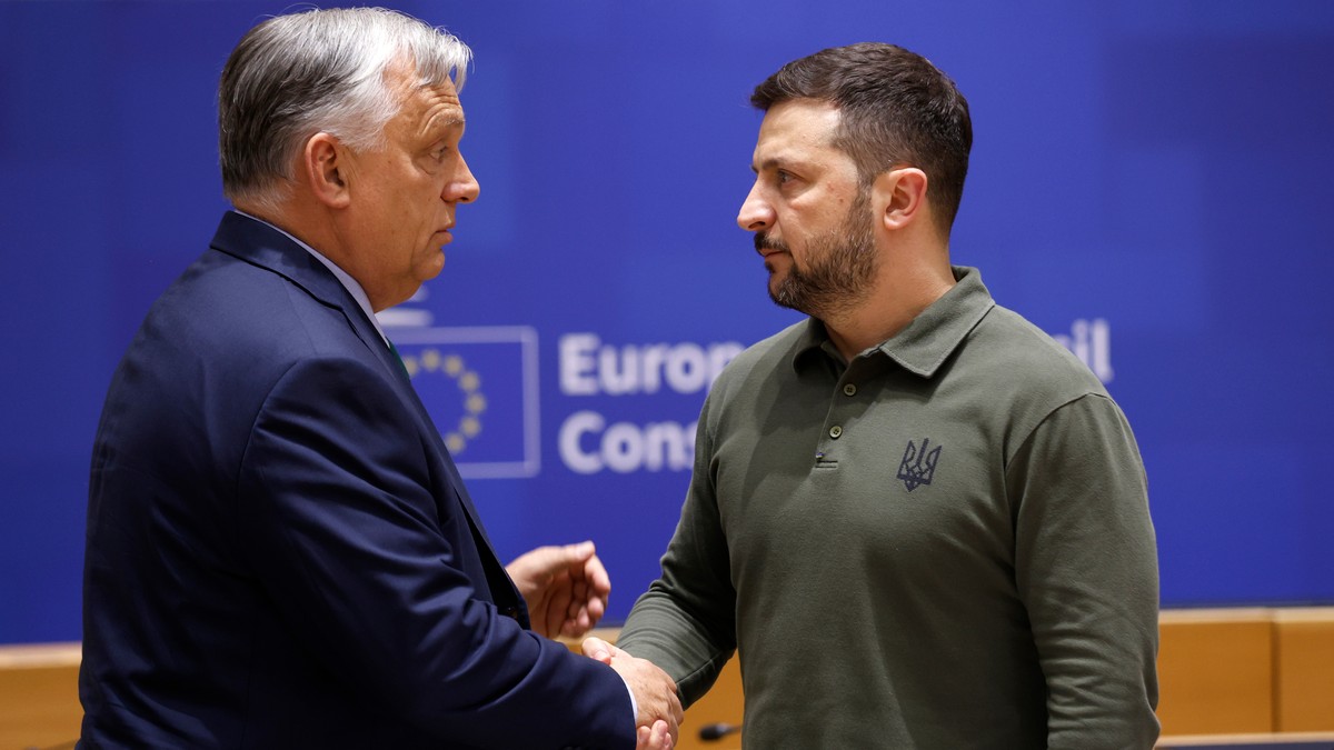 FILE -Hungary's Prime Minister Viktor Orban, left, speaks with Ukraine's President Volodymyr Zelenskyy during a round table meeting at an EU summit in Brussels, June 27, 2024. (AP Photo/Omar ...