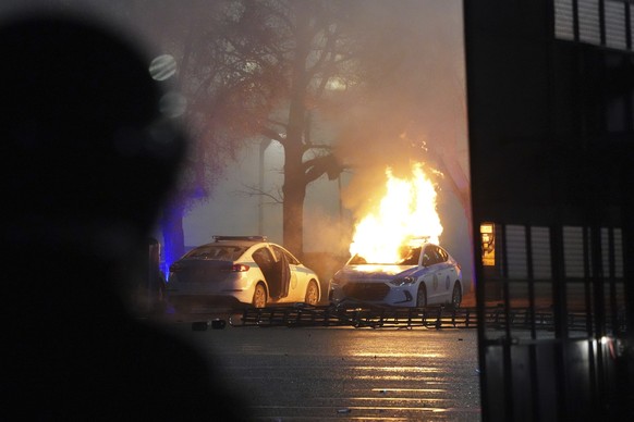 A police is in fire during a clashes with protesters in the center of Almaty, Kazakhstan, Wednesday, Jan. 5, 2022. Demonstrators denouncing the doubling of prices for liquefied gas have clashed with p ...