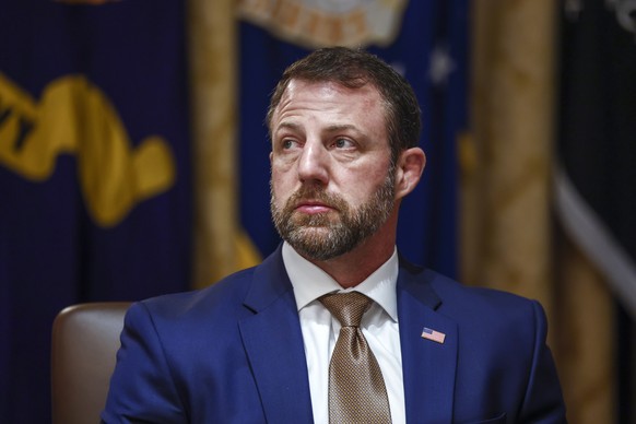 epa12851642 US Secretary of Homeland Security Markwayne Mullin listens to remarks during a cabinet meeting in the Cabinet Room of the White House in Washington, DC, USA, 26 March 2026. EPA/WILL OLIVER ...