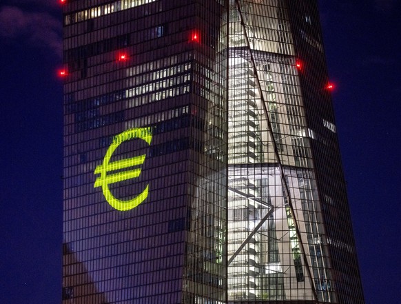 FILE - A light installation is projected onto the building of the European Central Bank during a rehearsal in Frankfurt, Germany, Dec. 30, 2021. Inflation hit a new record in the 19 countries that use ...