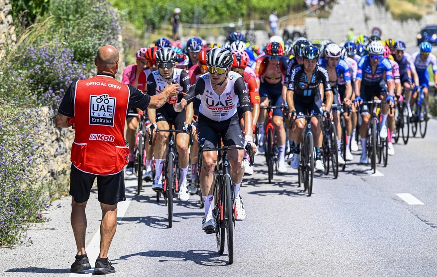 LEUKERBAD, SWITZERLAND - JUNE 14 : Rider of UAE TEAM EMIRATES getting a drink during stage 4 of the 86th edition of the 2023 Tour de Suisse cycling race 2.UWT, a stage of 152,5 kms with start in Month ...