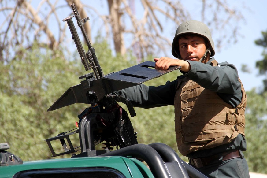 epa09403514 An Afghan security official patrol after they took back control of parts of Herat city following intense battle with Taliban militants, in Herat, Afghanistan, 07 August 2021. Heavy fightin ...