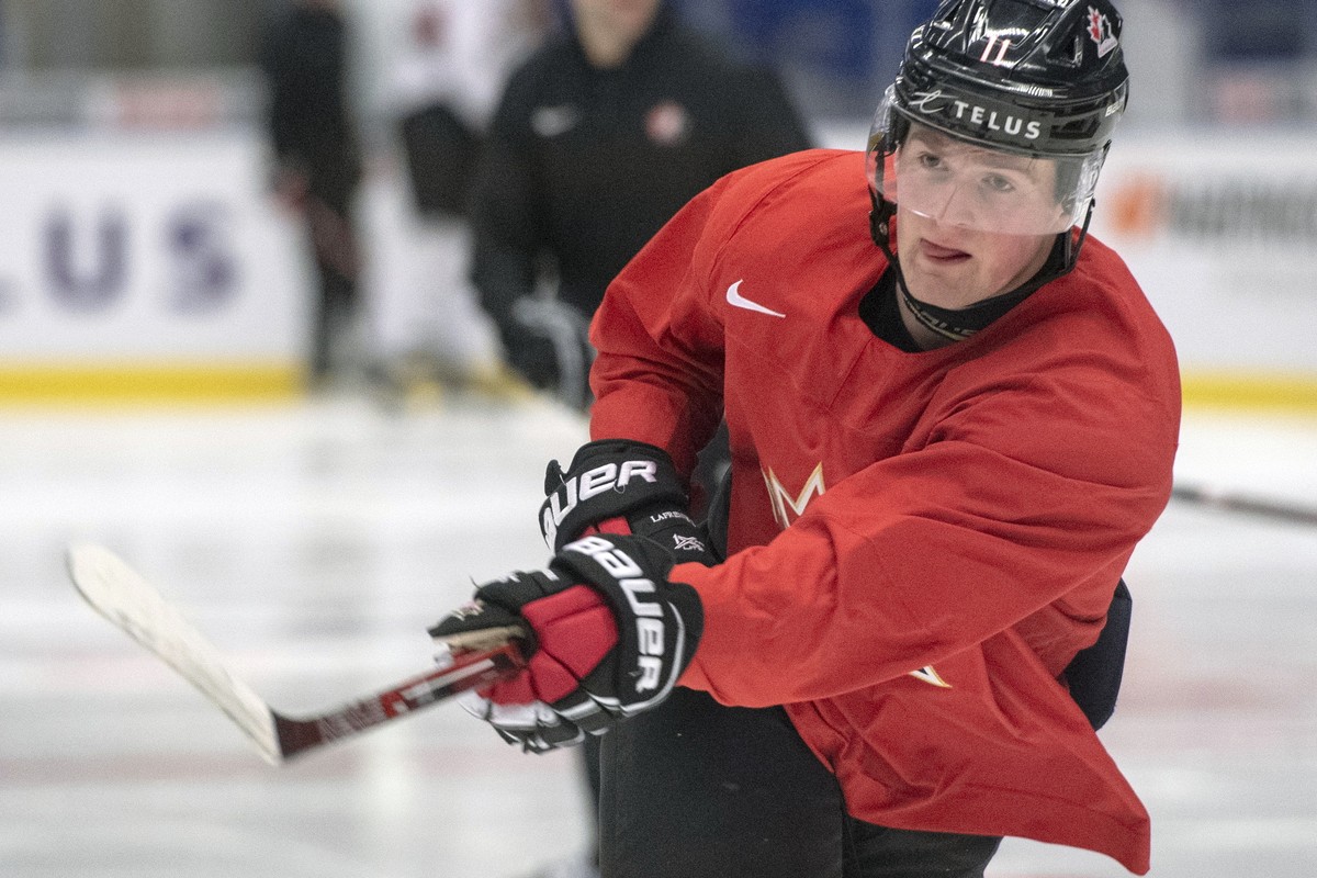 FILE - In this Jan. 1, 2020, file photo, Canada's Alexis Lafreniere shoots during the team's practice at the World Junior Hockey Championships in Ostrava, Czech Republic. The Detroit Red Win ...