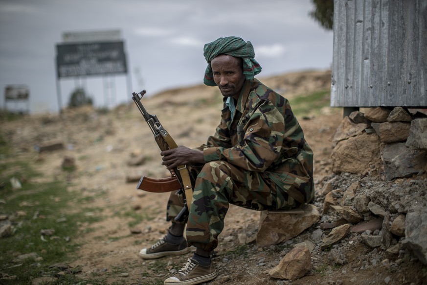 FILE - A fighter loyal to the Tigray People&#039;s Liberation Front (TPLF) mans a guard post on the outskirts of the town of Hawzen in the Tigray region of northern Ethiopia on May 7, 2021. Prime Mini ...